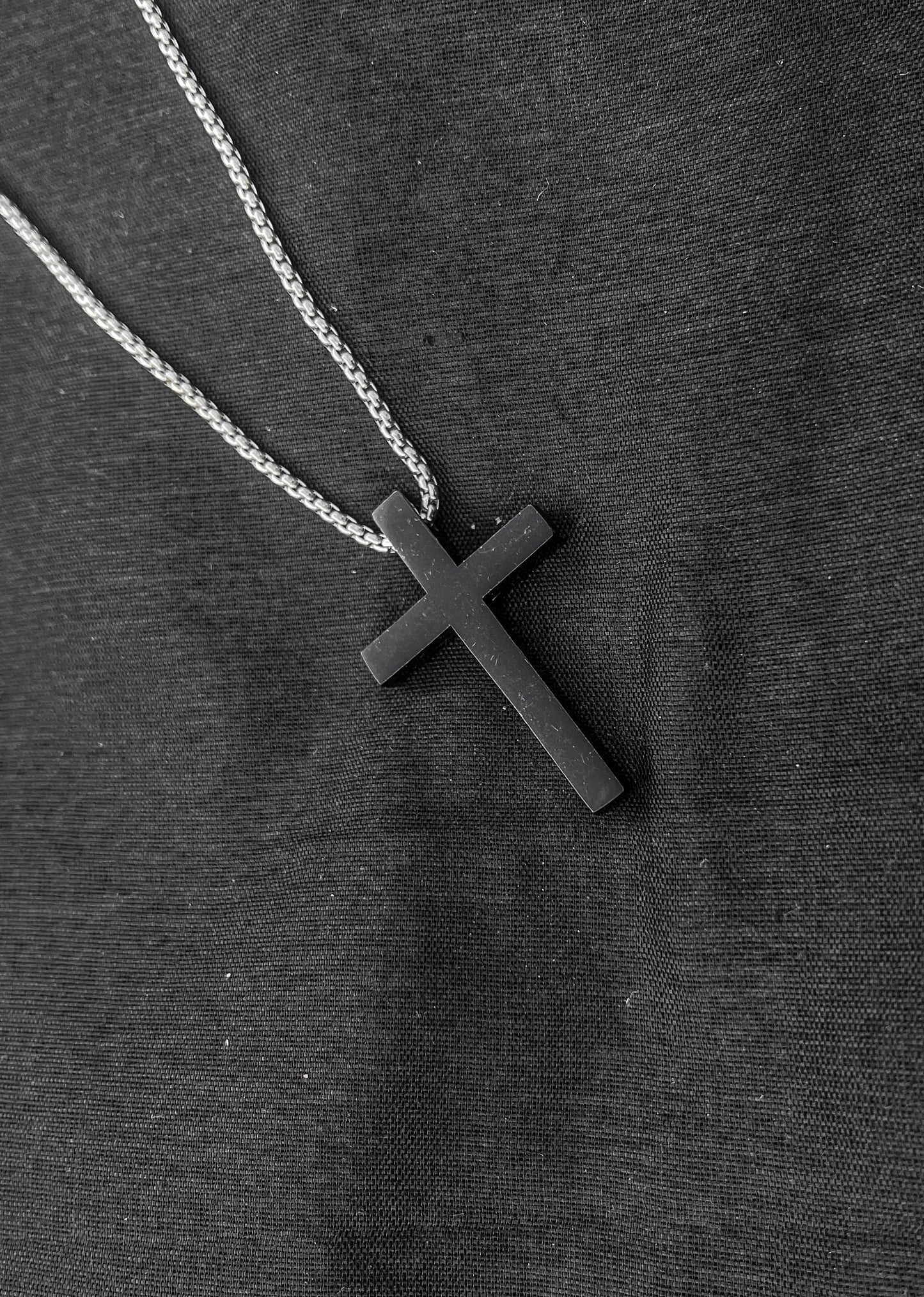 Black dotted bracelet and cross chain